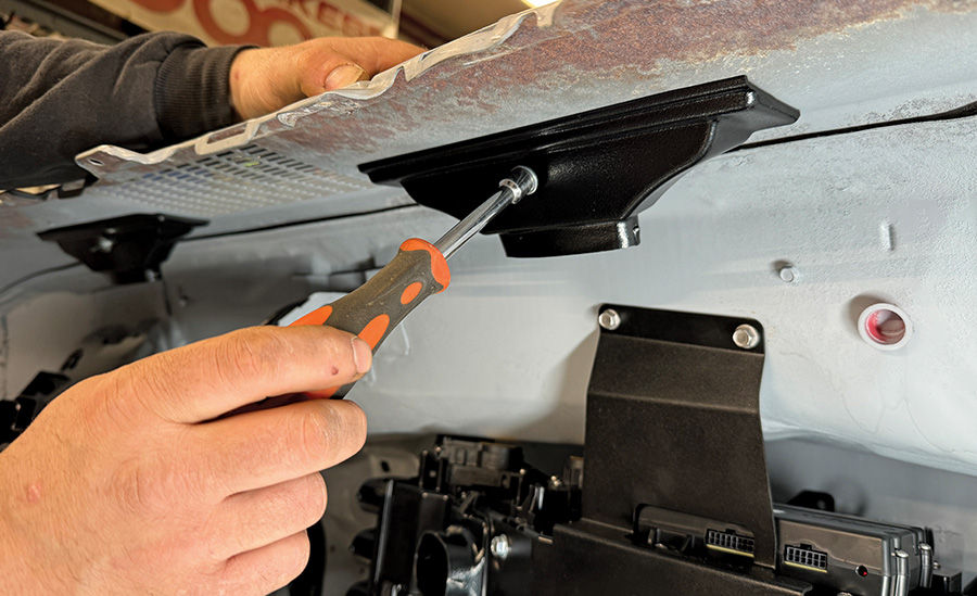 Using the provided hardware, mount the (two) defrost ducts in place to the OEM defrost duct mounting flanges located under the dash