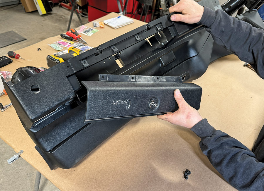 The new OER glovebox door was first fitted with a new lock and key set and then installed to the lower dash using hardware from the supplied mounting kit