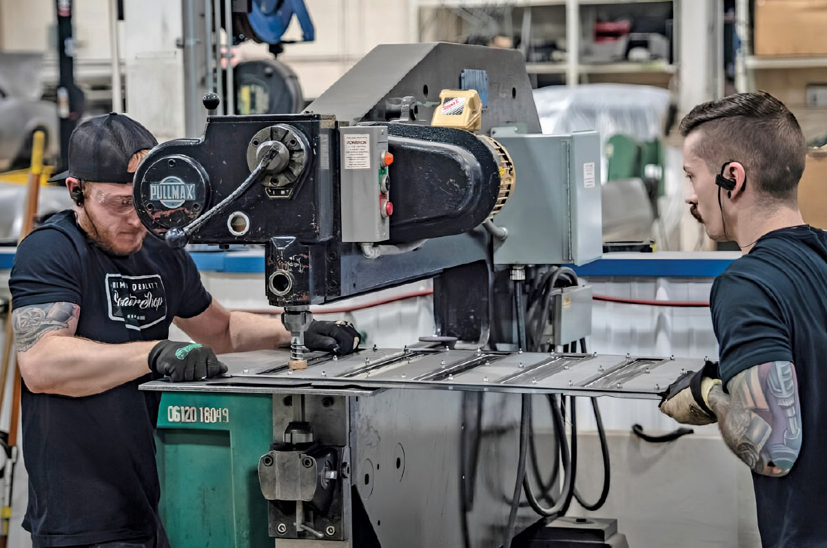 1968 Camaro rear floor panel being bead-rolled by Roadster Shop fabricators
