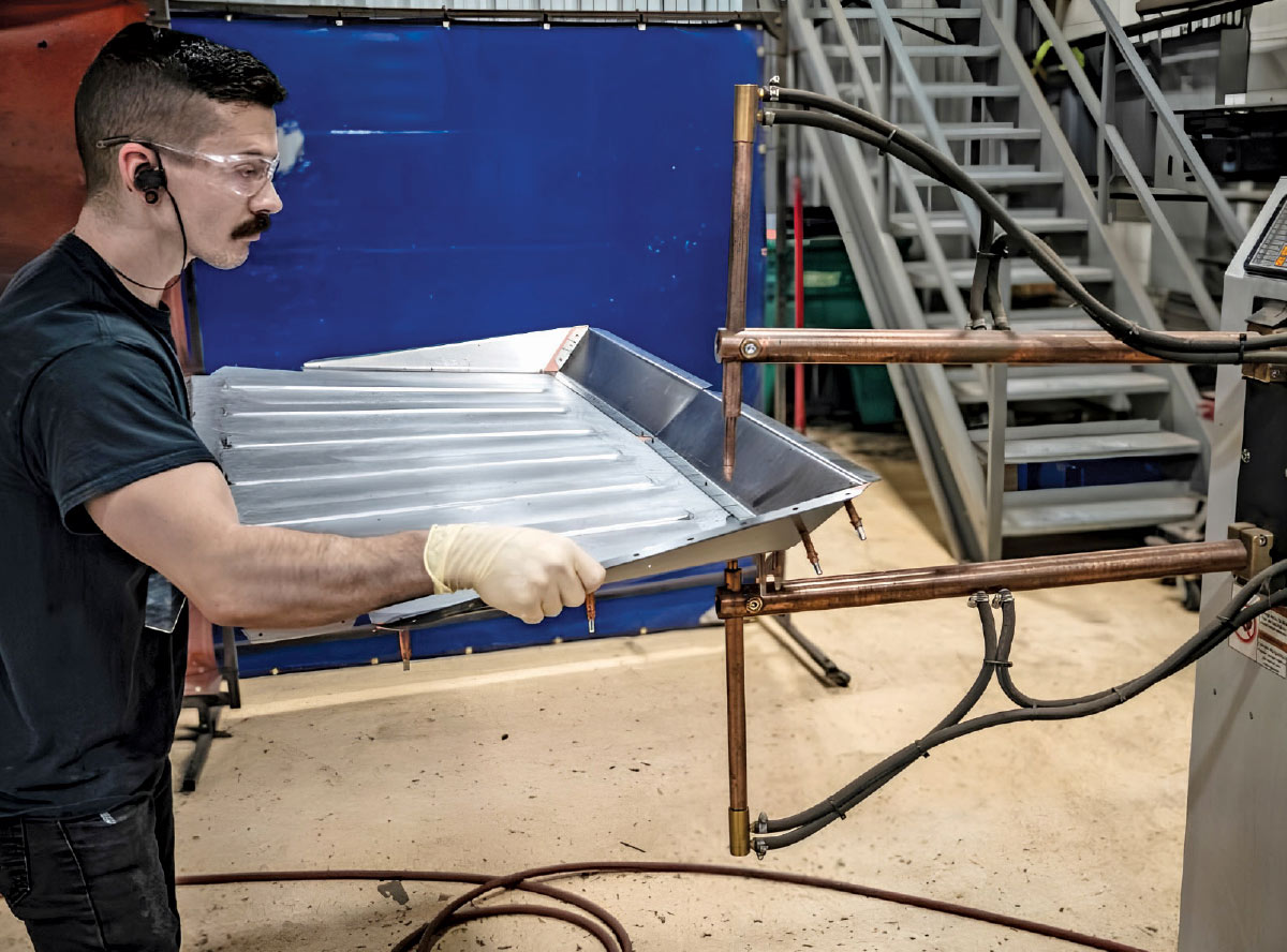1968 Camaro trunk pan spot welded in fixture using dual-arm resistance welder for precision