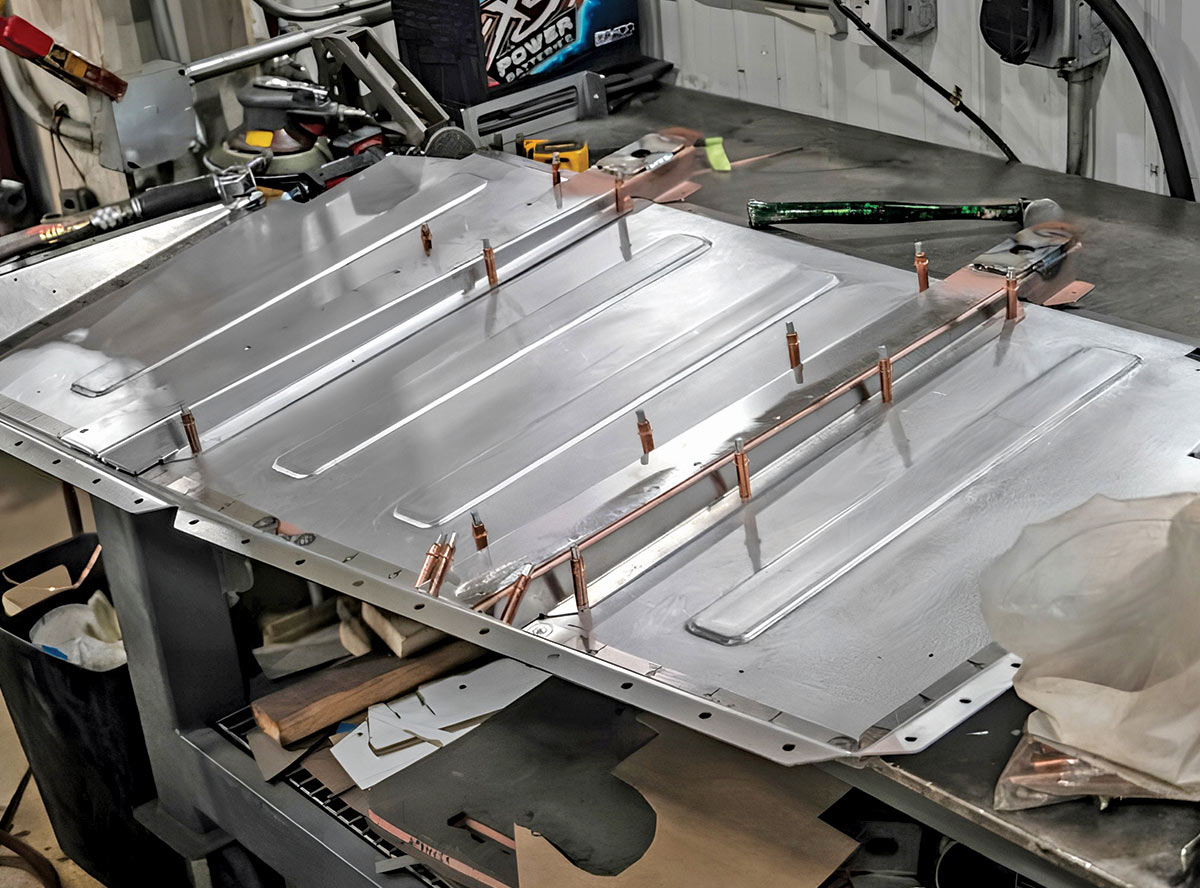 1968 Camaro trunk floor panel mocked up with Cleco pins for alignment on fab bench