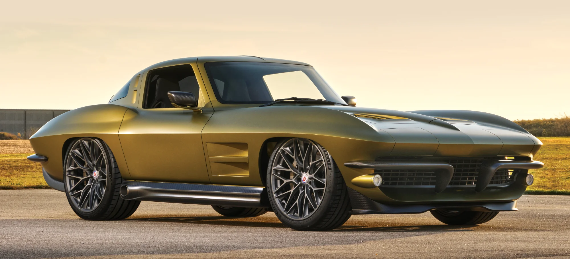 side view of olive green 1963 Corvette