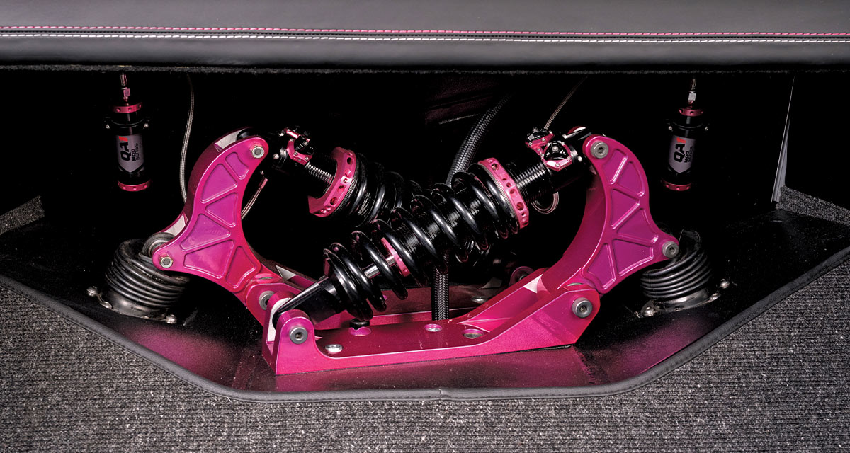 rear view of a limited-edition 1969 Nova's trunk showing exposed pink and black suspension components