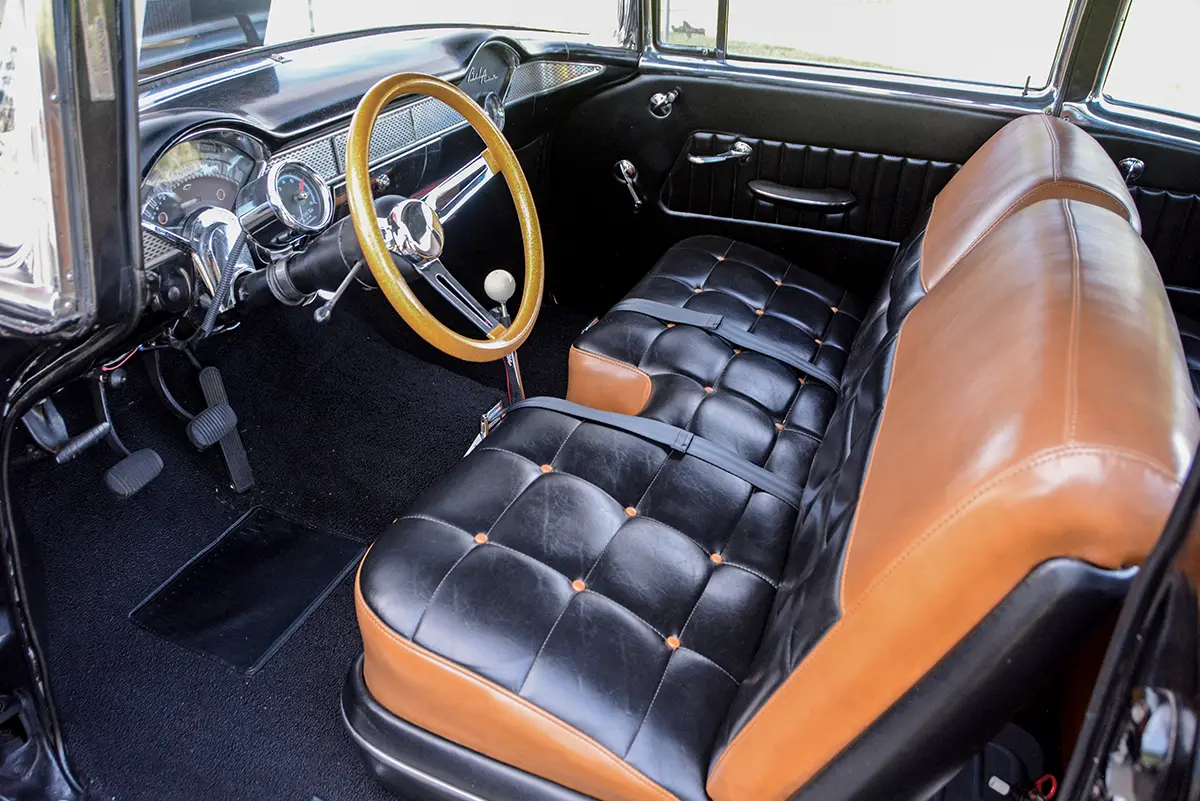 1955 Chevy Gasser interior black and tan bench seat with gold wood steering wheel