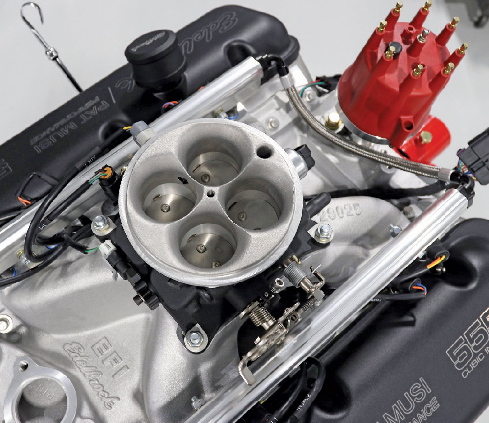 Close-up of 4-barrel EFI throttle body on Edelbrock intake with 555 valve covers