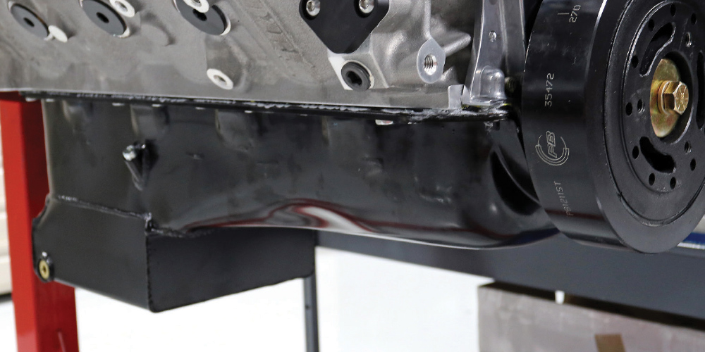Engine oil pan and ATI Super Damper installed on Dart block for high-RPM crankshaft stability