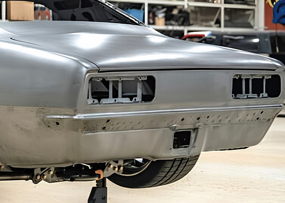 1968 Camaro bare metal body taillight panel mock-up on jack stands