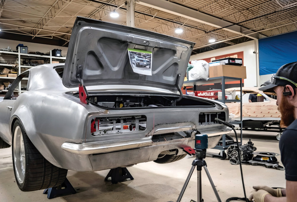 1968 Camaro builder using laser alignment tool for custom rear bumper layout