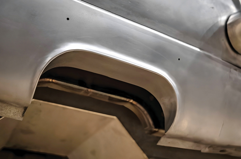 1968 Camaro mini tub close-up hand-formed arch finished raw metal look