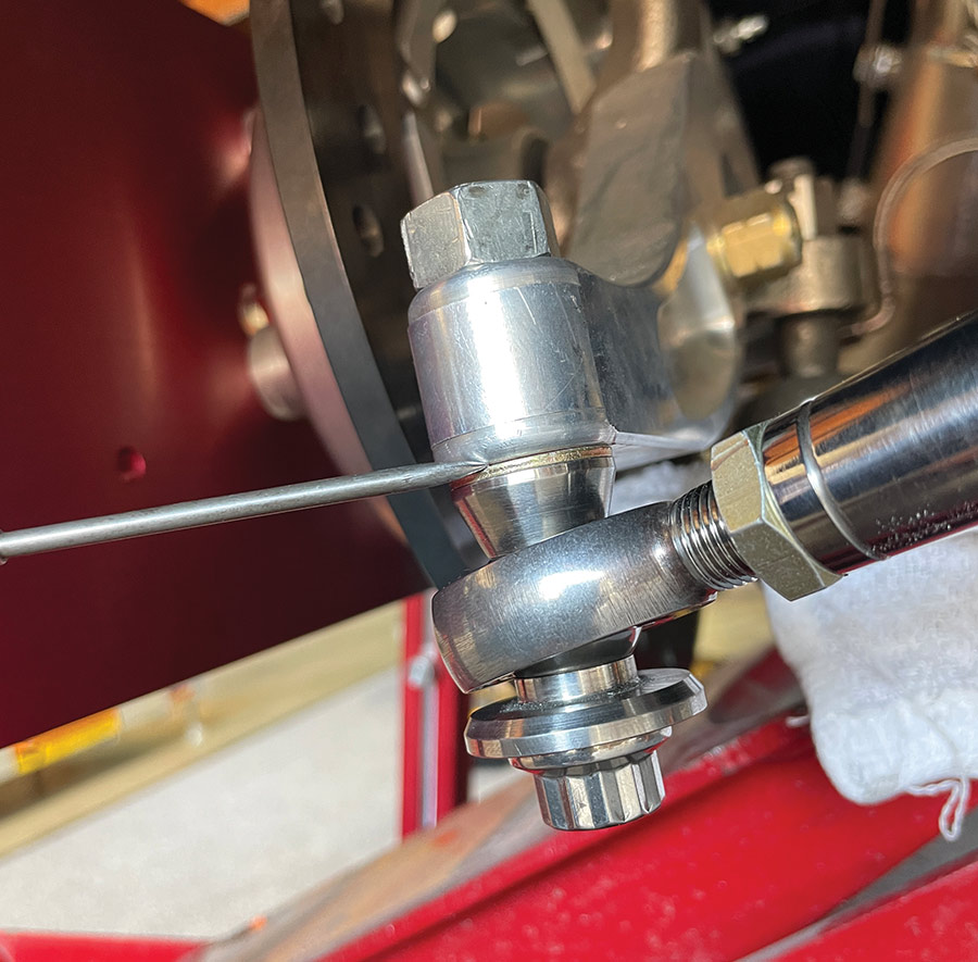 close-up of heim joint and laser string on spindle arm