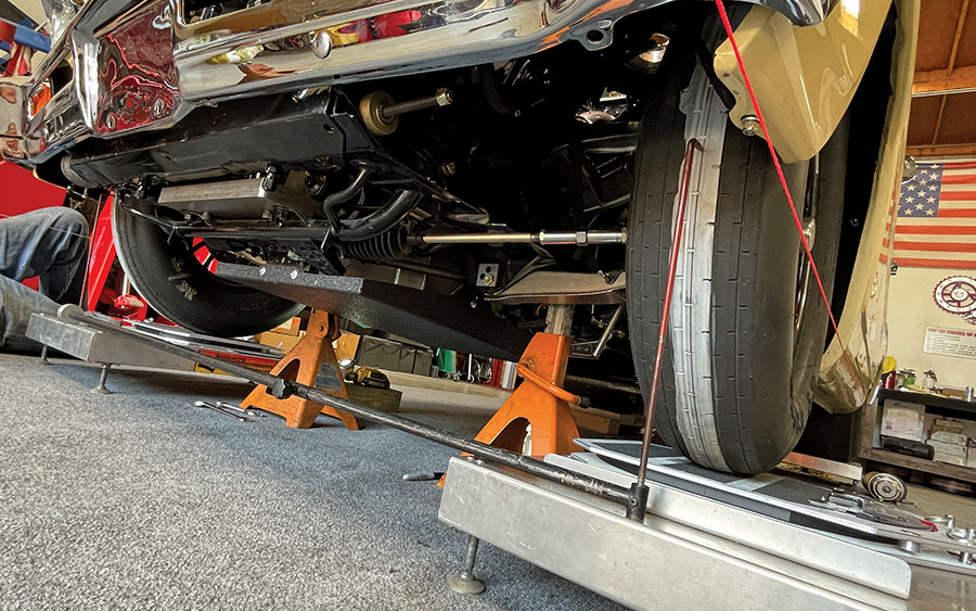 1966 nova front suspension visible during alignment with string bar