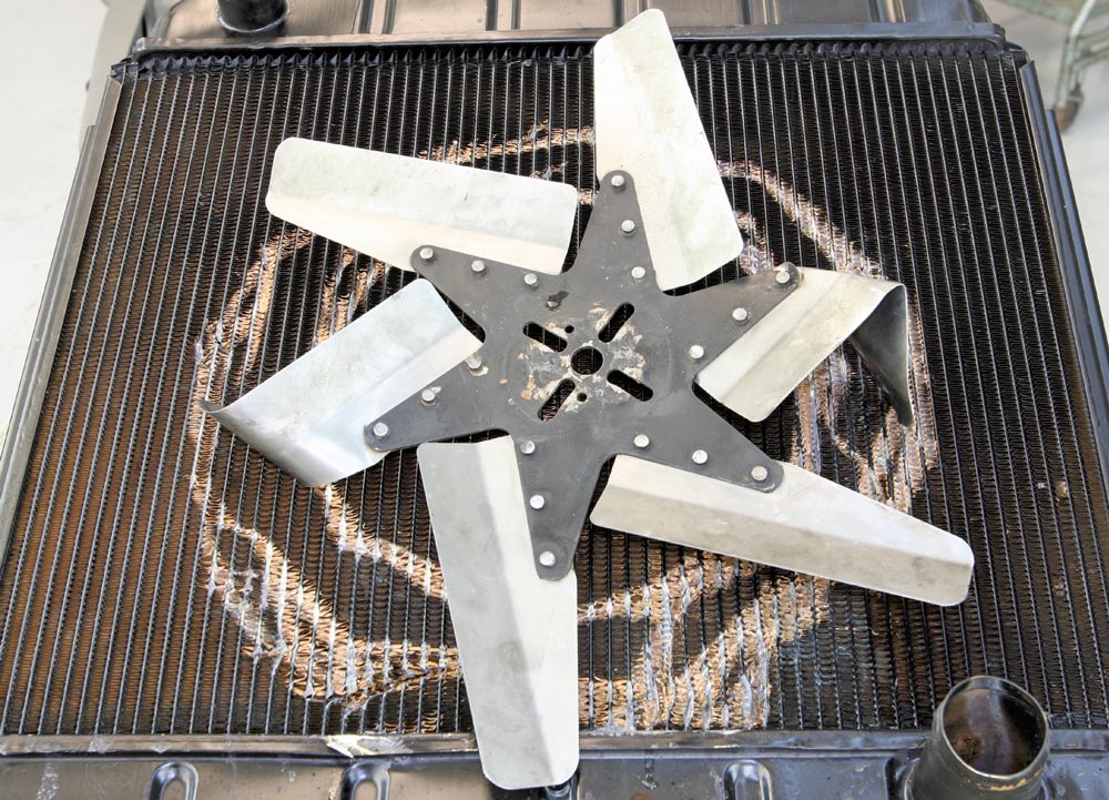 Bent flex fan from radiator impact – evidence of contact from improper fit or fan failure