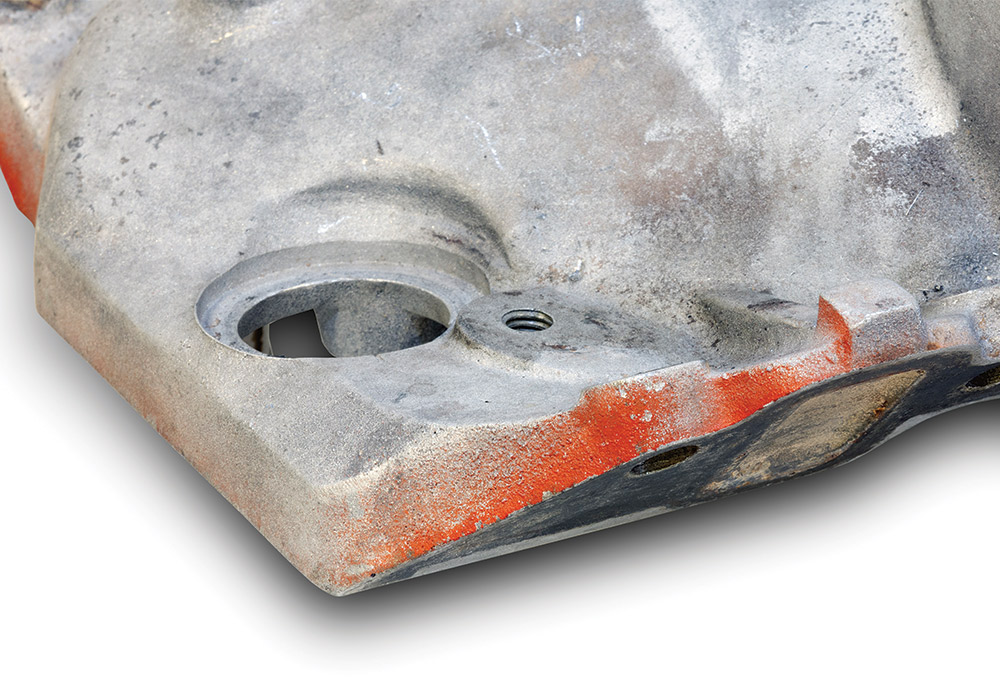 orange engine paint remnants on old intake manifold