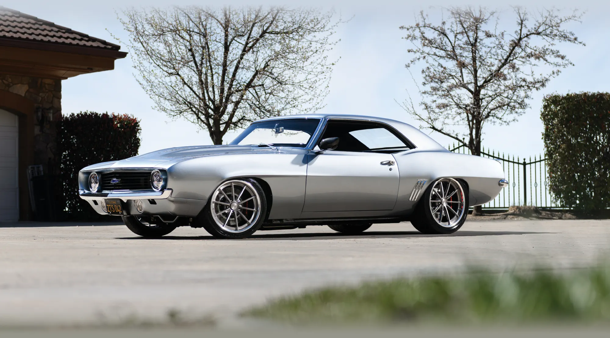 A silver 1969 Chevrolet Camaro parked outdoors.