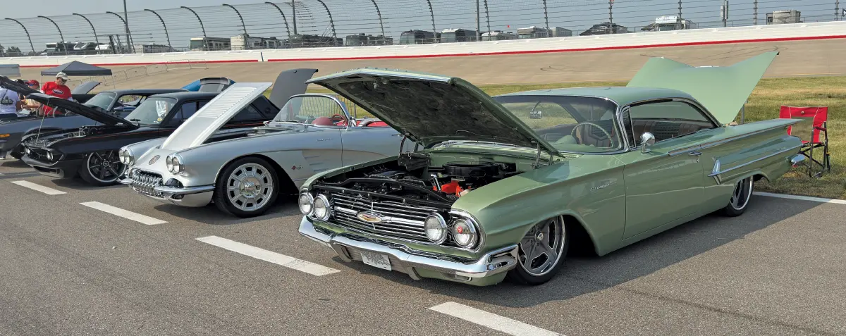 1960 Chevrolet Impala coupe – light green, hood open at car show