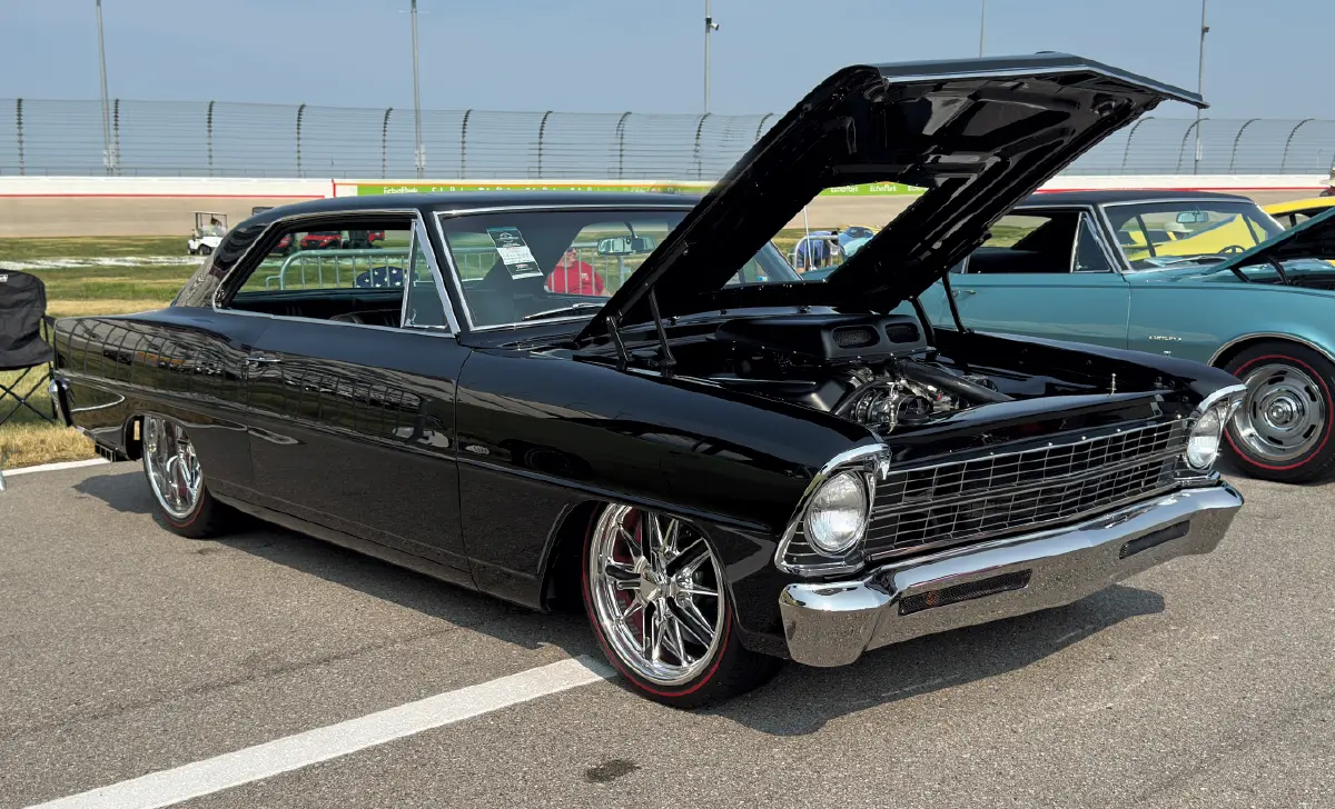 1967 Chevrolet Nova – black, chrome bumpers, hood open