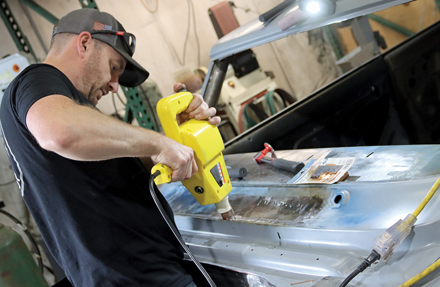 1967 Nova cowl panel smoothed using electric heat-shrinker tool and hammers for final shaping