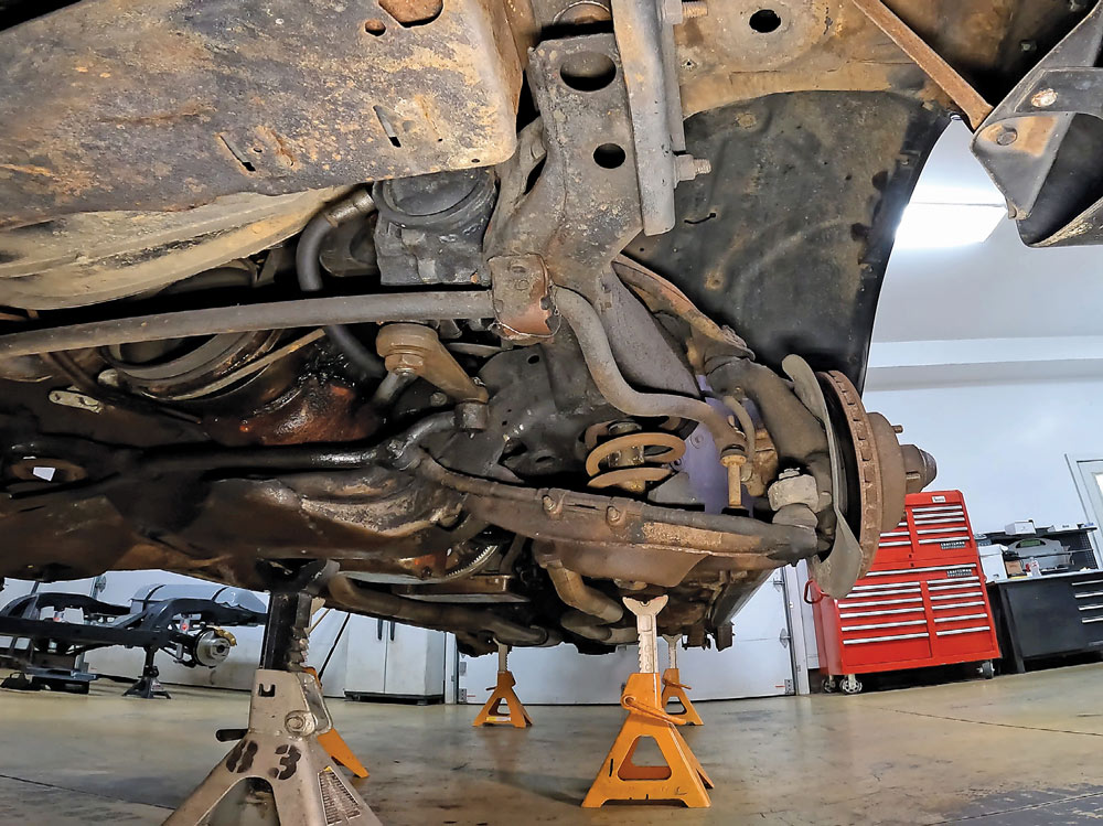 1978 camaro original front suspension disassembled on jack stands