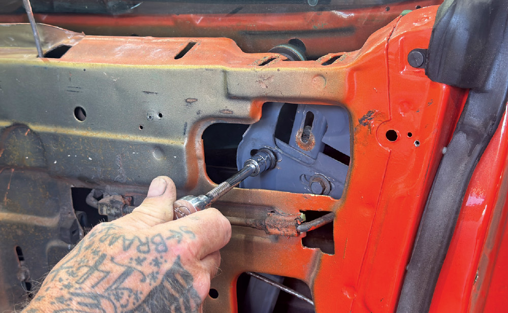 1971 camaro window regulator bolt install closeup with ratchet tool
