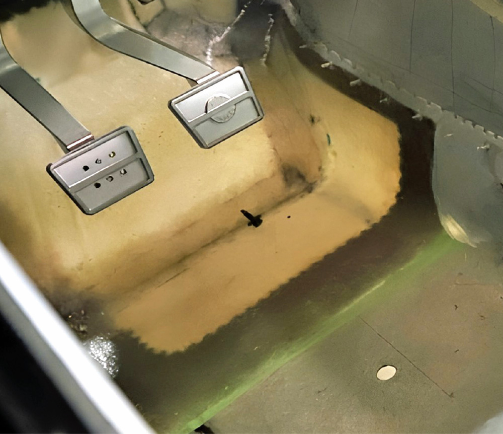 1965 Corvette pedal box area with aluminum firewall and modern pedal mounts