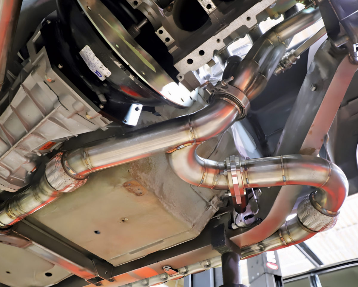 Close-up underside view showing custom steering and suspension joints.