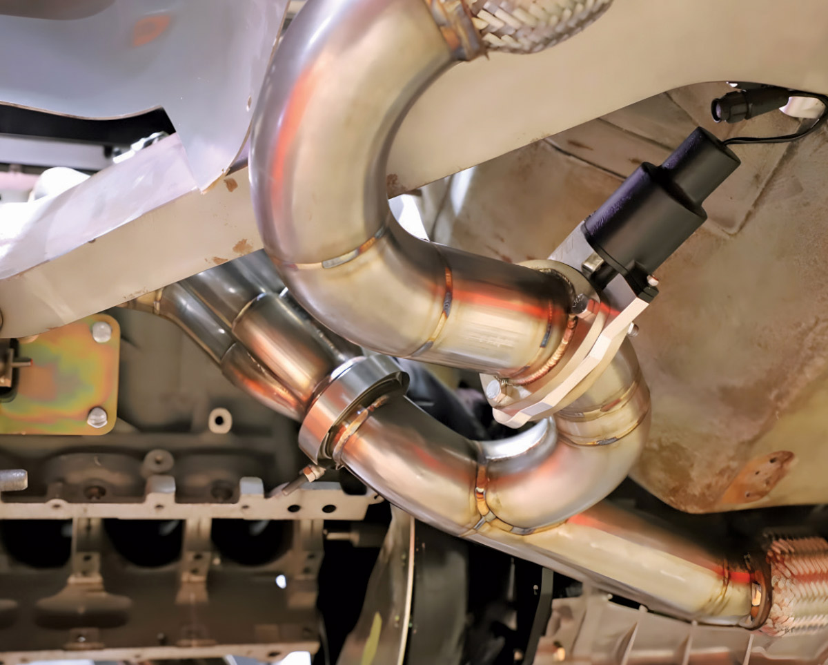 Detailed view of a custom steering rack and linkage assembly.