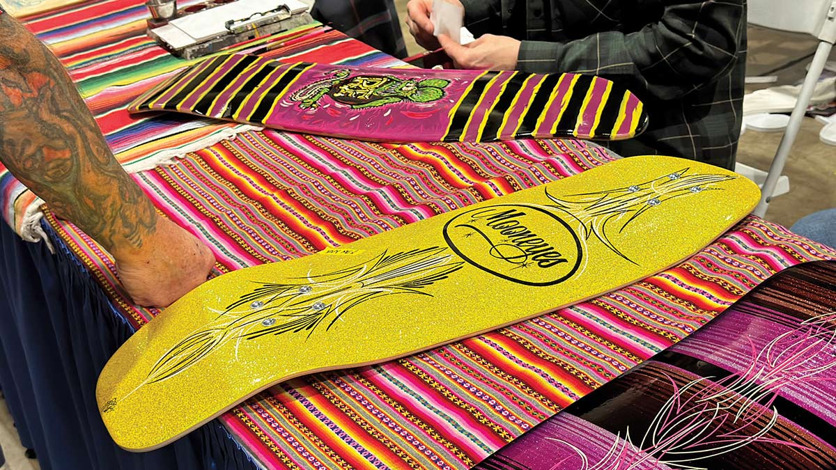 Row of custom pinstriped skateboard decks