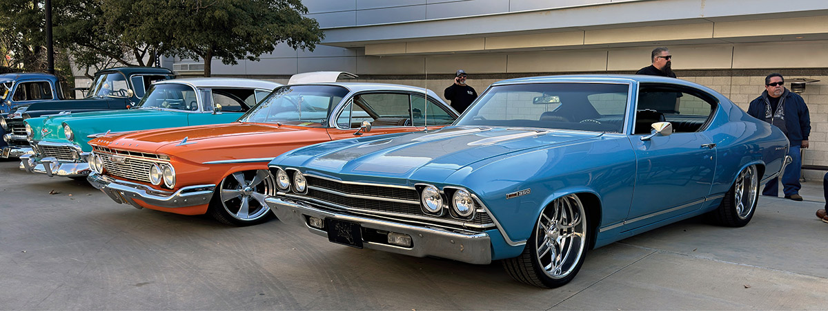 Outdoor display of orange and blue Chevys