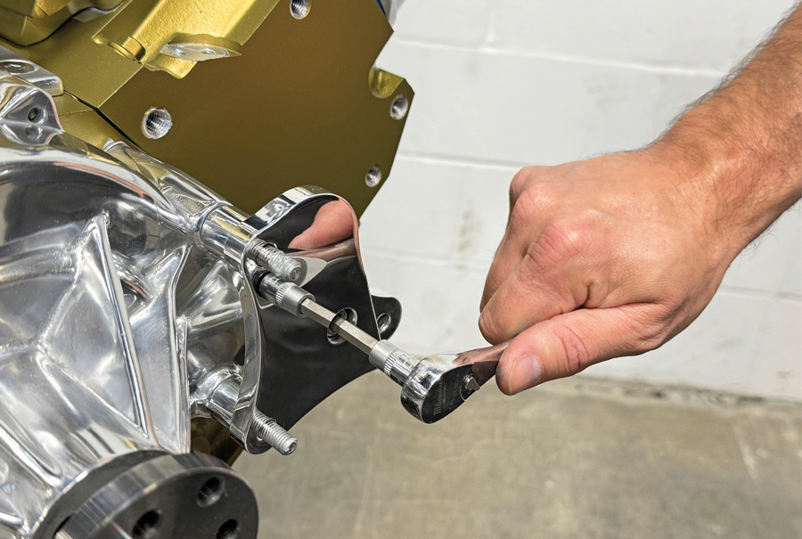 Installing rear alternator bracket with socket capscrew