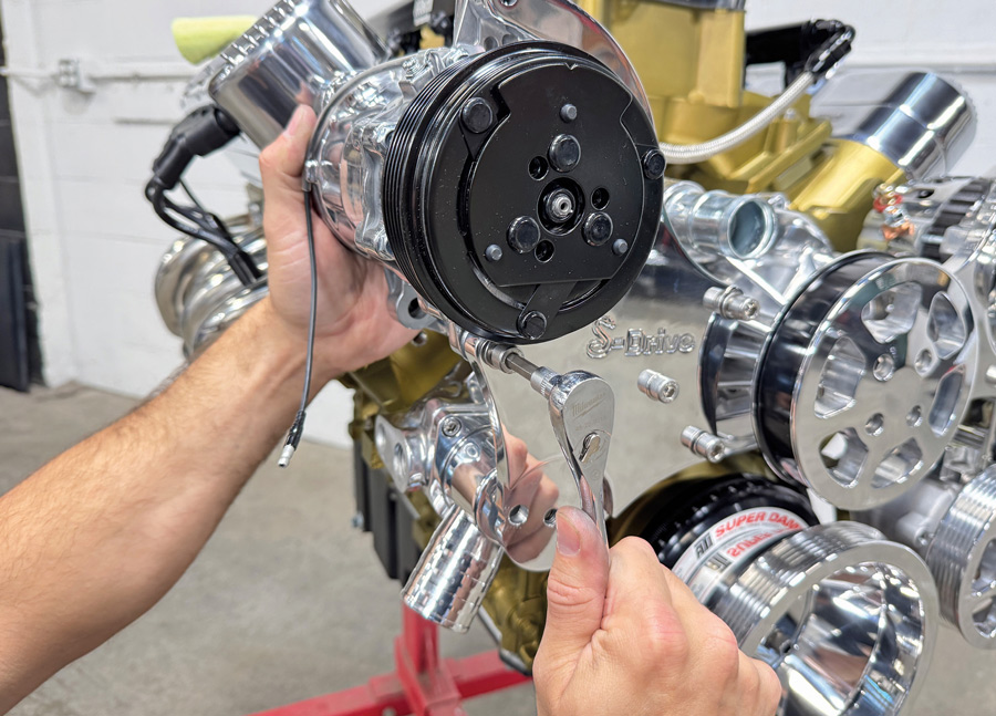 Mounting the A/C compressor onto the bracket