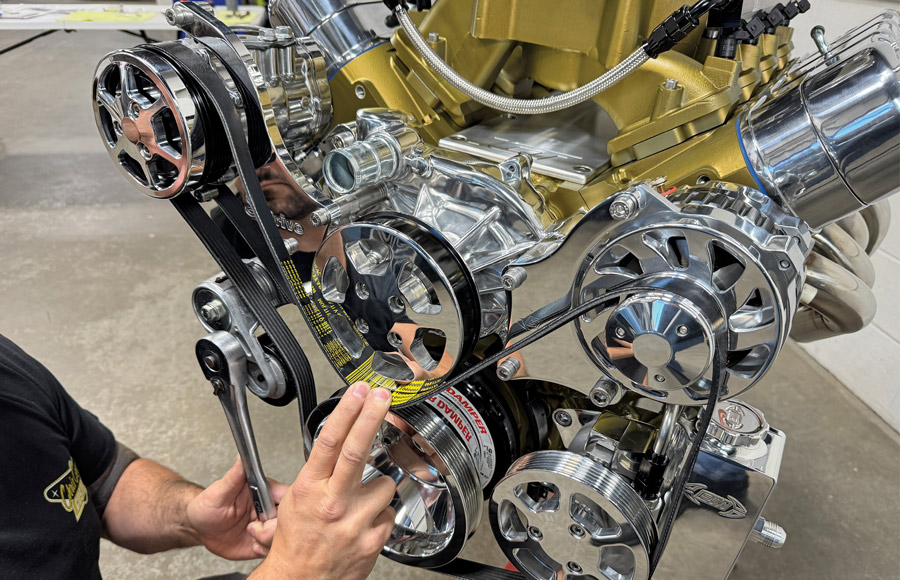 Routing the serpentine belt over the pulleys