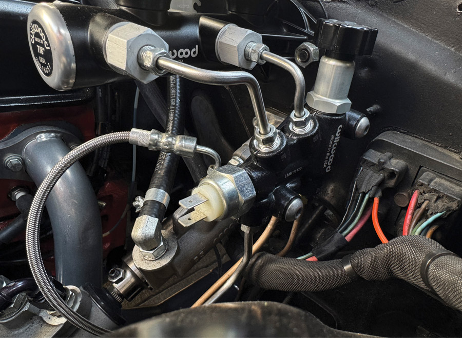 Proportioning valve installed near master cylinder.