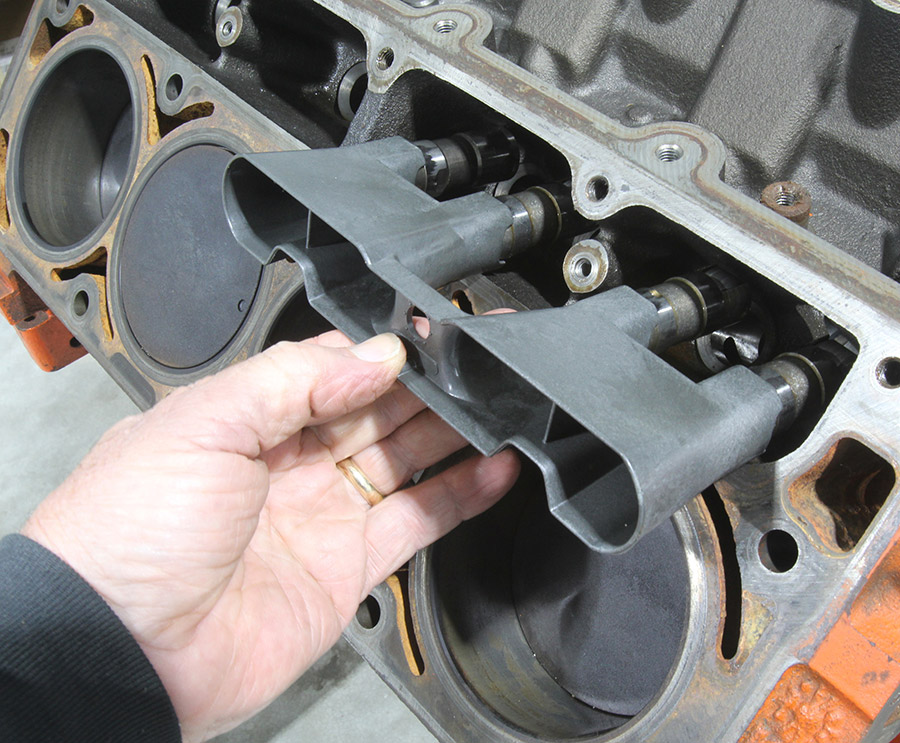 Inserting new lifters into plastic holders.