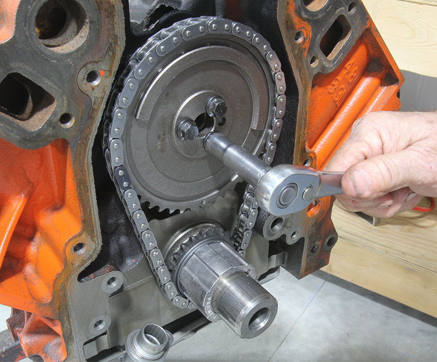Torquing cam sprocket bolts on timing set.