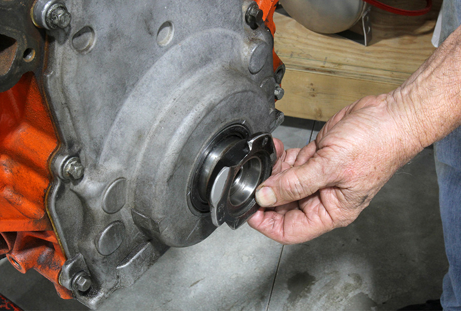 Installing harmonic balancer seal into cover.