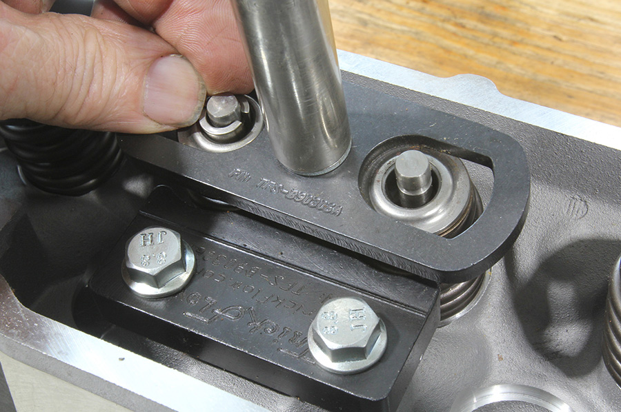 Compressing valvesprings with TFS compressor tool.