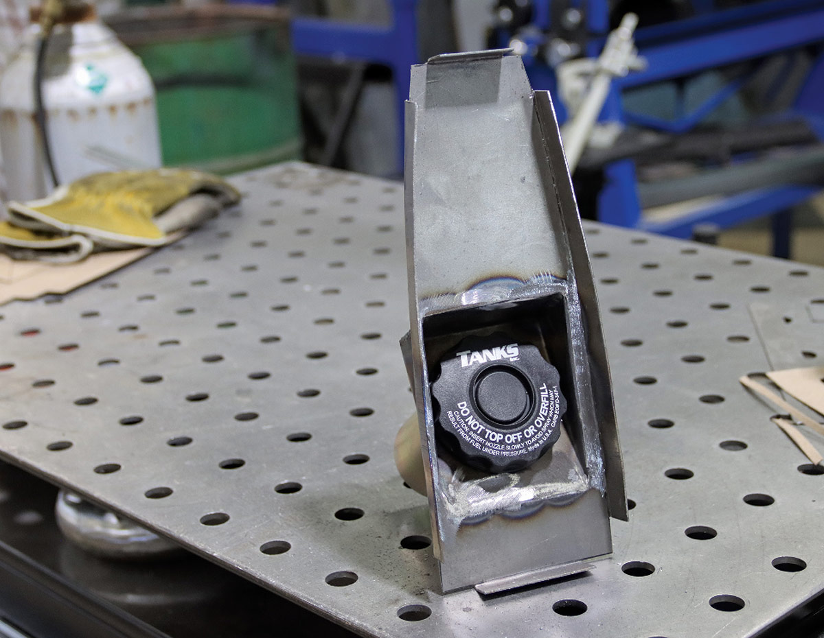 Gas cap sitting inside the fabricated metal housing.