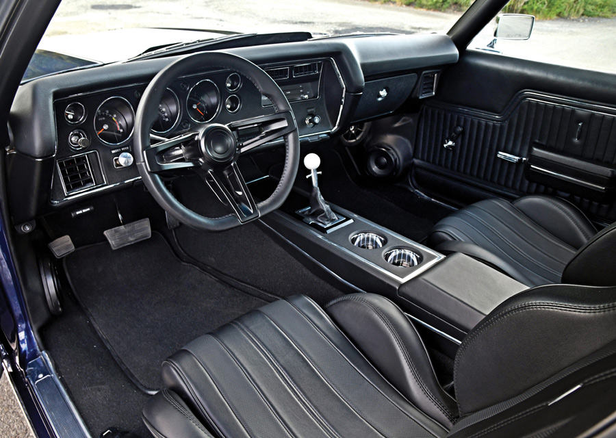 Interior view showing Sparco front seats and custom dashboard