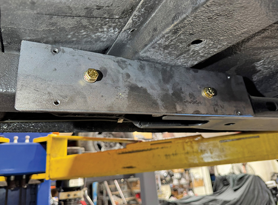 Custom mounting bracket bolted to the car subframe.