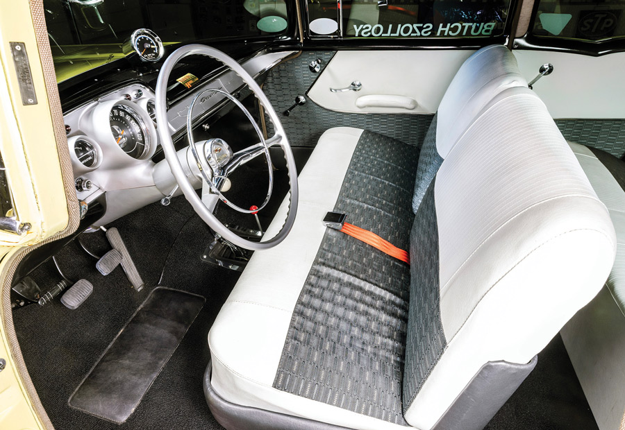 Interior cabin showing reproduction silver and black vinyl upholstery and original dashboard