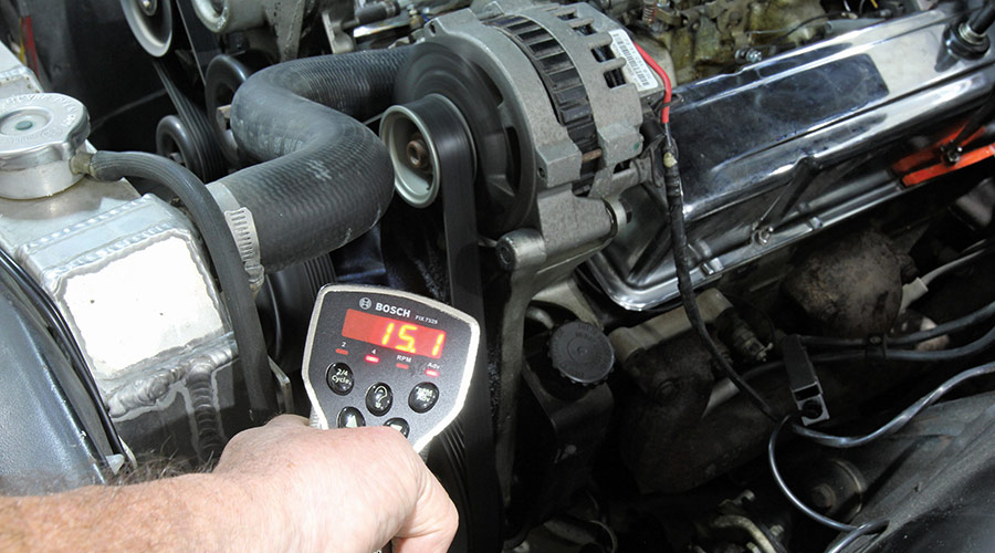 Digital timing tool used to verify initial timing on a running V8 engine.