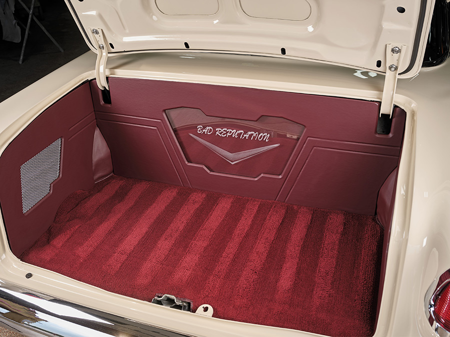 Custom upholstered trunk with red carpet and Bad Reputation logo.