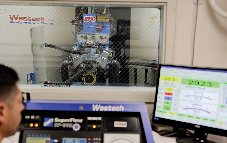 Monitoring dyno results on a computer screen.
