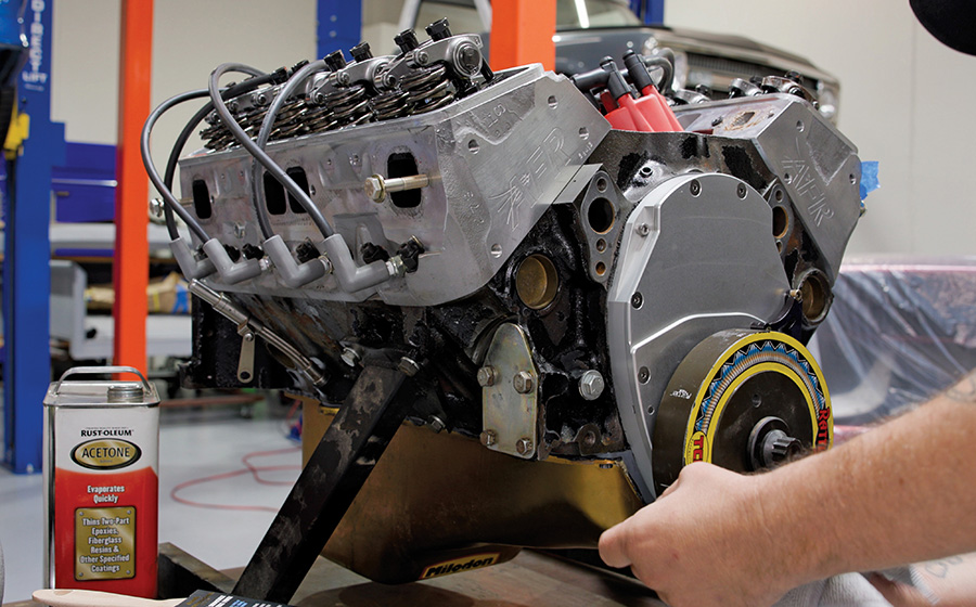 Cleaning the engine block for painting.