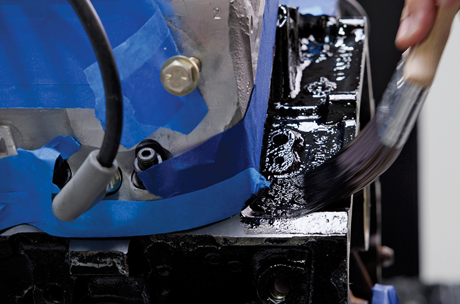 Close-up of freshly painted black engine block.