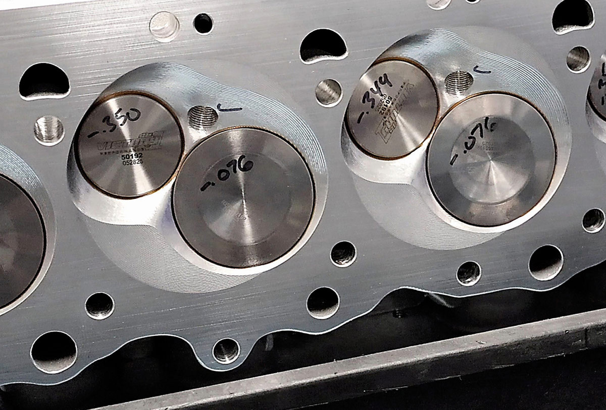 Underside of a cylinder head showing titanium intake and exhaust valves.