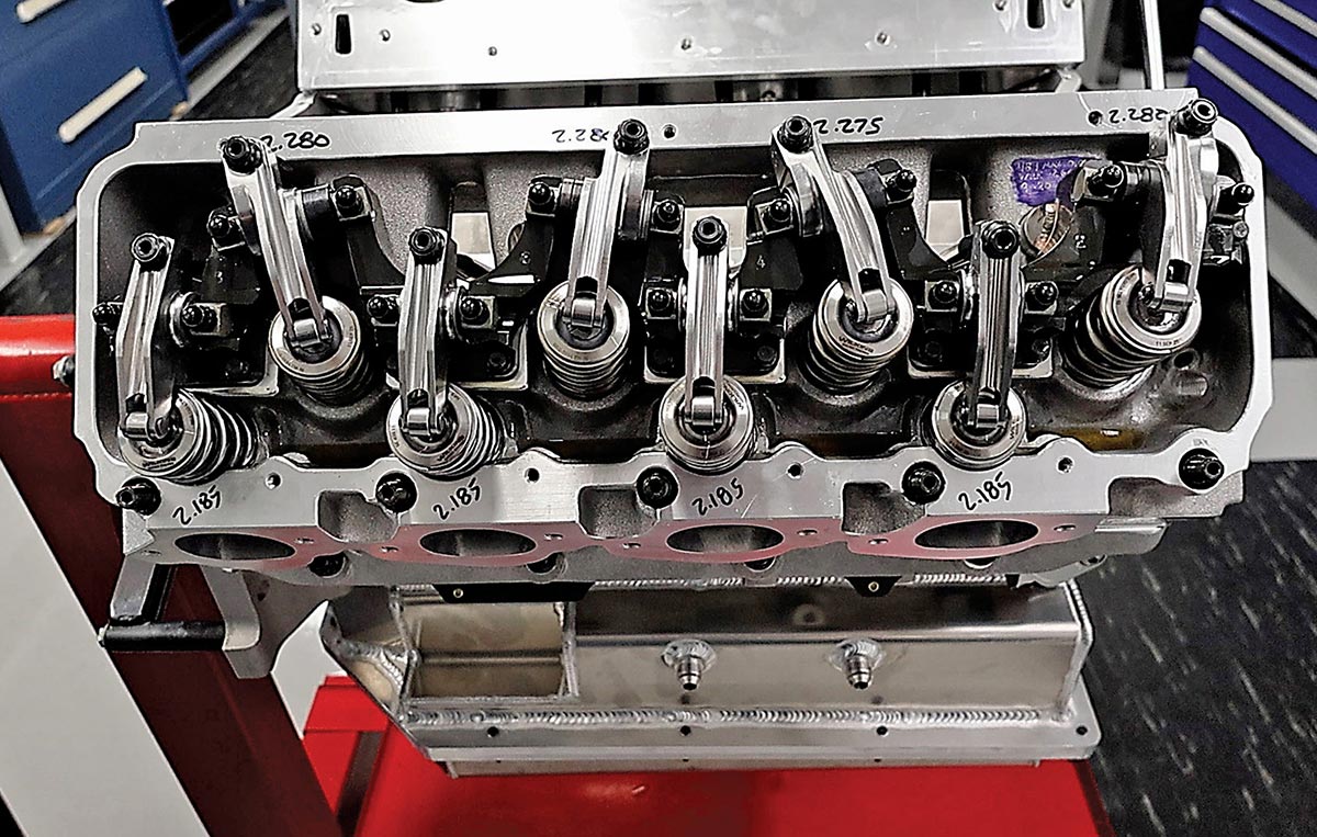 Detailed view of pushrod routing and steel Jesel rocker arms.