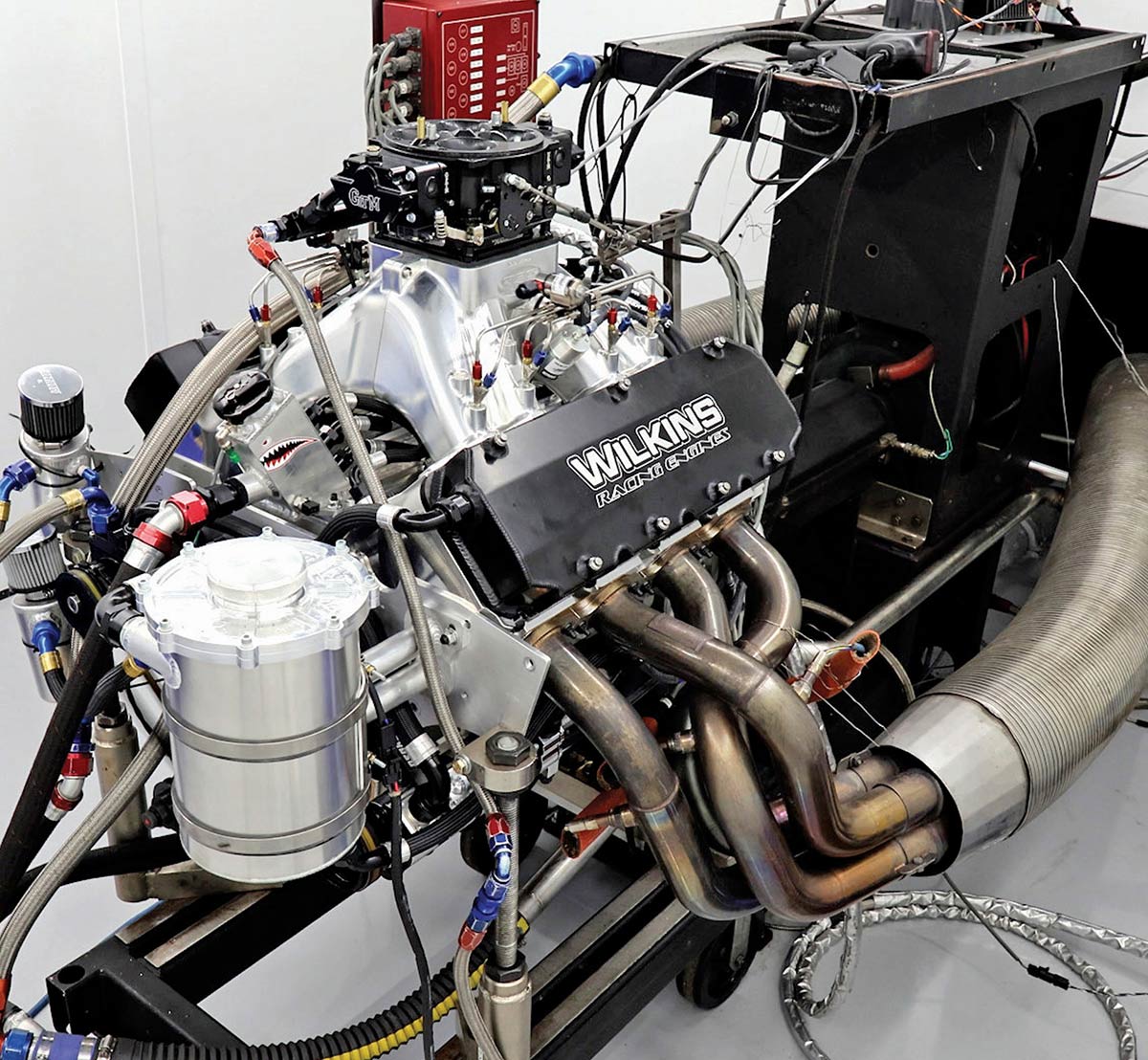 Complete high-performance engine on a dyno stand ready for testing.