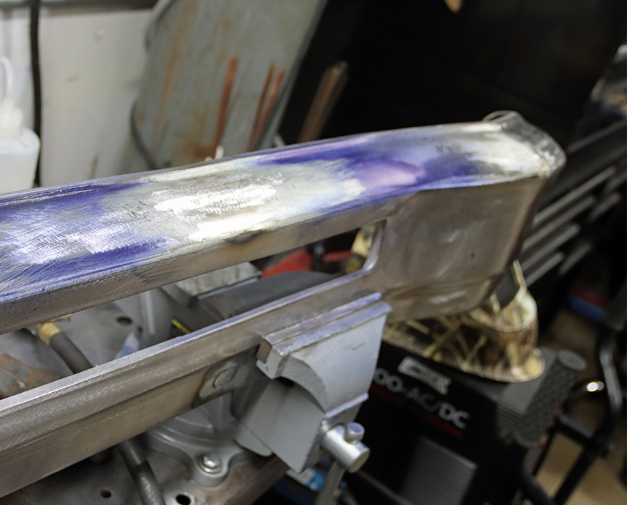 Bumper surface ground smooth after stud welding.