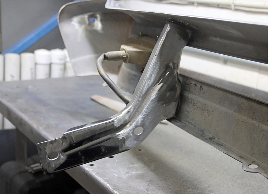 Modification of original bumper mounting brackets.